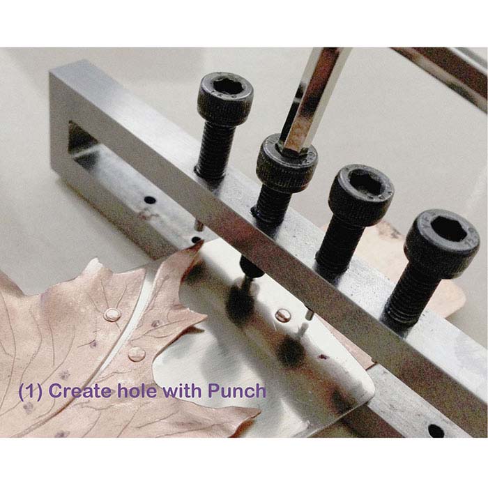 Deluxe Four-Hole Metal Punch