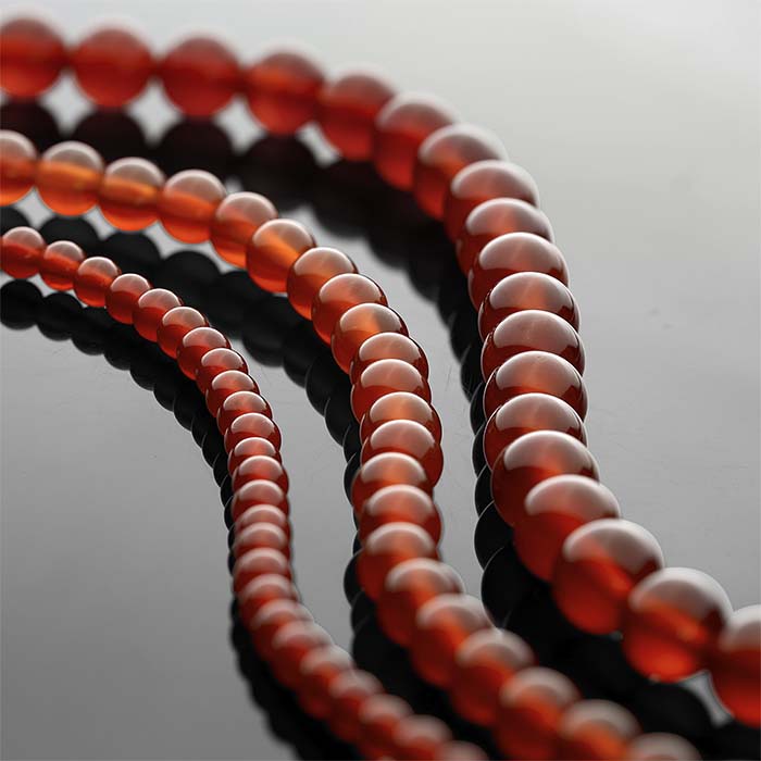 Karneol 4 mm rund pärlsträng